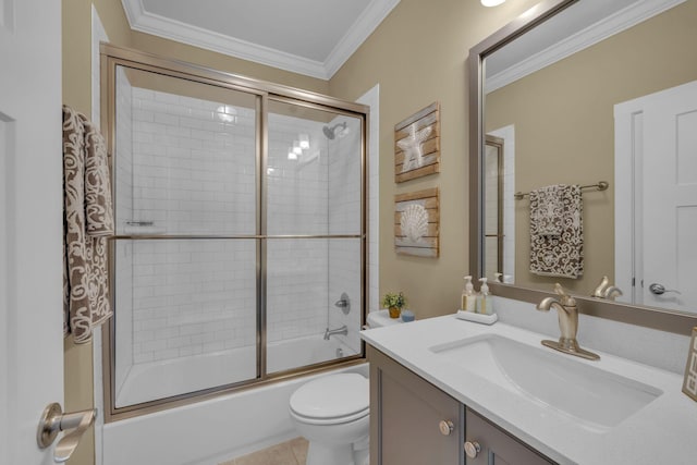 full bathroom with ornamental molding, vanity, shower / bath combination with glass door, and toilet