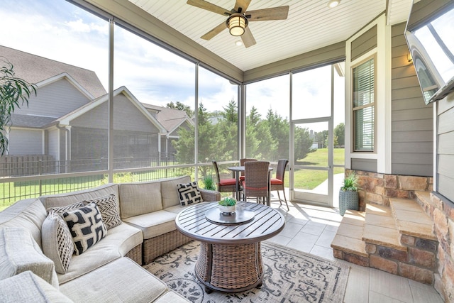 sunroom / solarium with ceiling fan