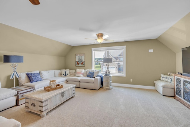 carpeted living room with ceiling fan and lofted ceiling