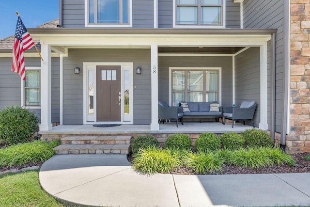 doorway to property with covered porch