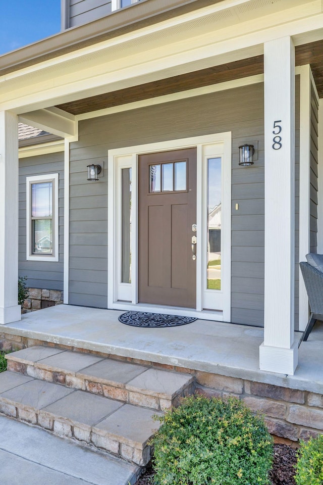 entrance to property featuring a porch