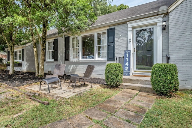 doorway to property with a patio