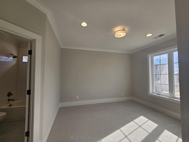 interior space with crown molding and light colored carpet