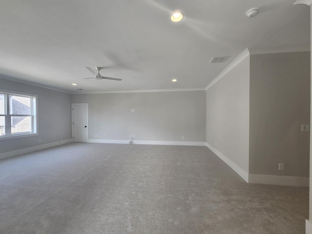 carpeted empty room with crown molding and ceiling fan