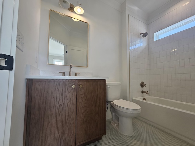 full bathroom featuring vanity, tile patterned floors, toilet, and tiled shower / bath