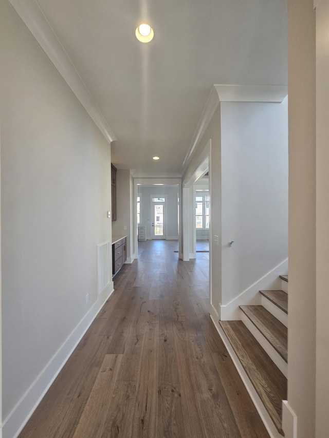 hallway featuring crown molding and wood-type flooring