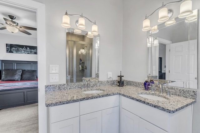 bathroom featuring vanity, ceiling fan, and walk in shower