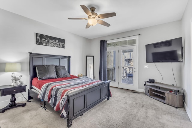 carpeted bedroom featuring access to outside and ceiling fan