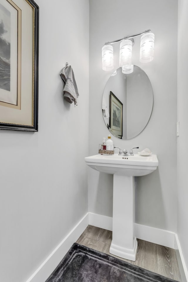 bathroom with hardwood / wood-style floors