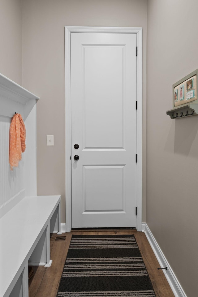 mudroom with dark wood-type flooring