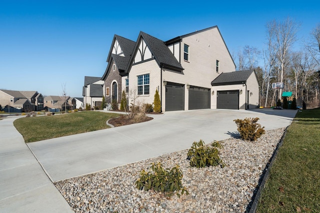 view of side of property with a garage and a yard