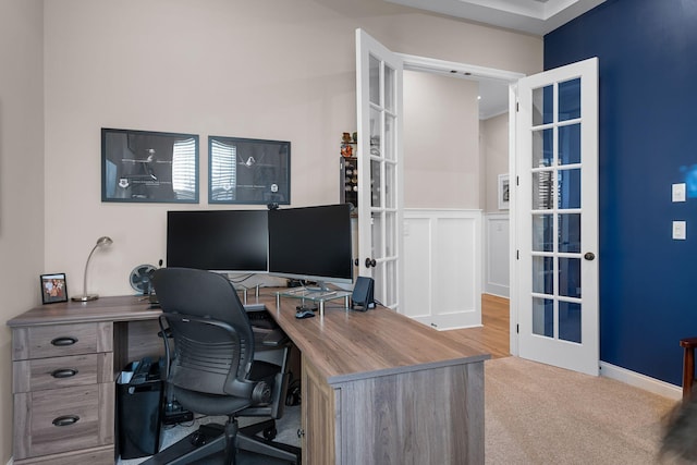 carpeted office featuring french doors