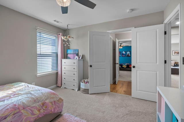 bedroom with light colored carpet and ceiling fan