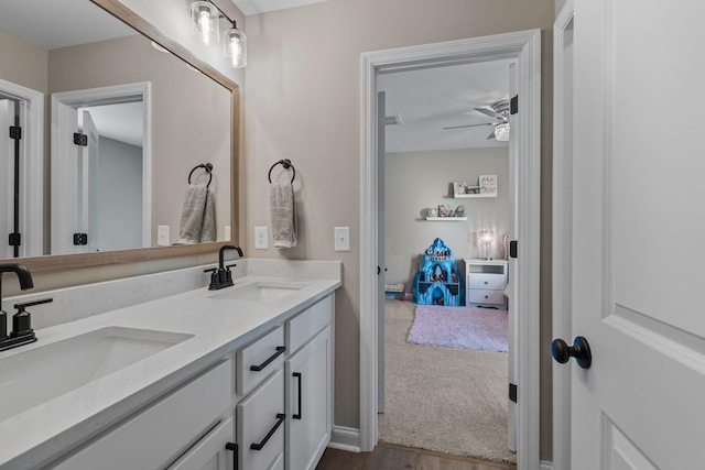 bathroom featuring ceiling fan and vanity