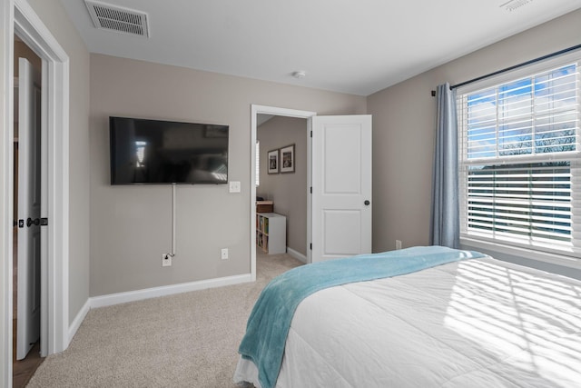 bedroom with light colored carpet