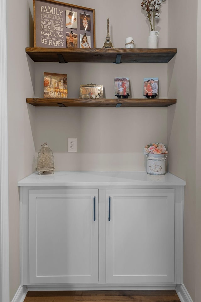 bar featuring white cabinetry