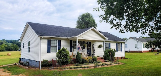 view of front facade with crawl space, roof with shingles, and a front lawn