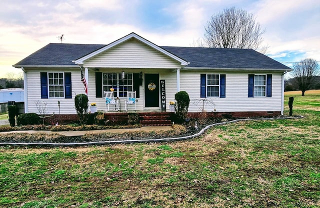 ranch-style home with a porch, crawl space, and a front lawn