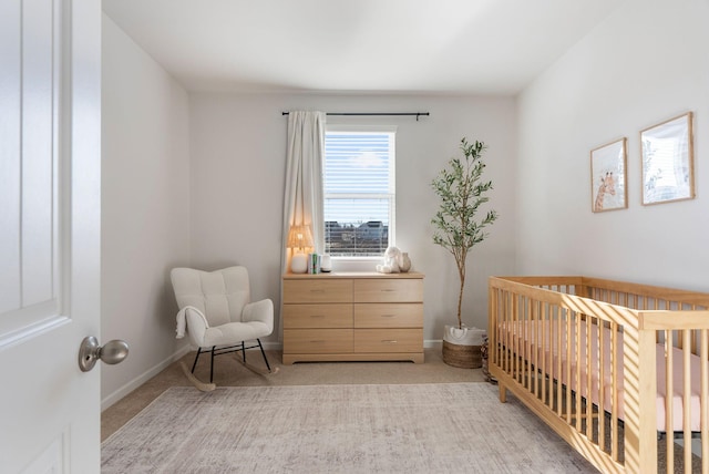 carpeted bedroom with a crib