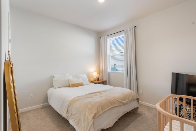 bedroom with light colored carpet