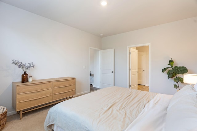 bedroom with light colored carpet