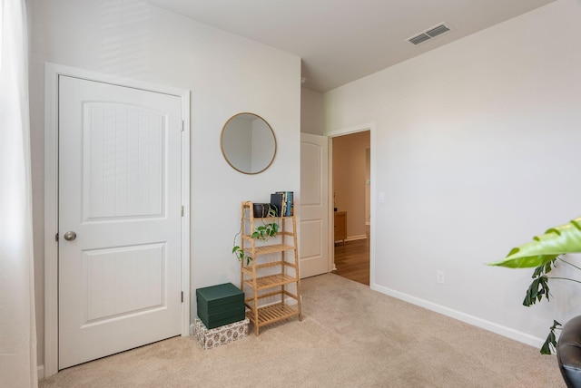 interior space with light colored carpet