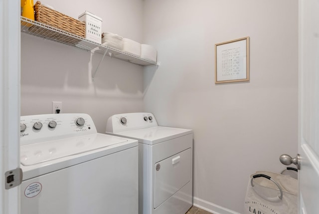 laundry area with independent washer and dryer