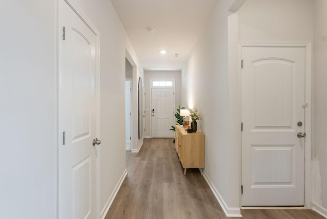 hallway featuring light hardwood / wood-style flooring