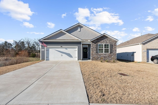 view of front of property with a garage and a front lawn