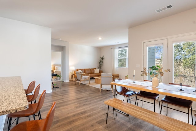 dining room with hardwood / wood-style flooring