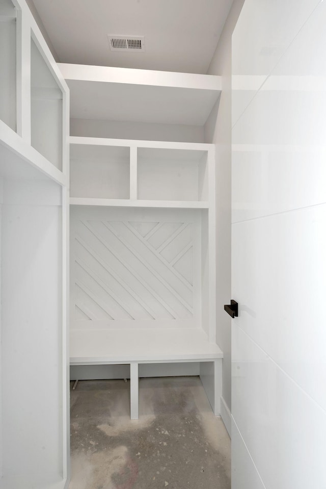 mudroom featuring concrete flooring