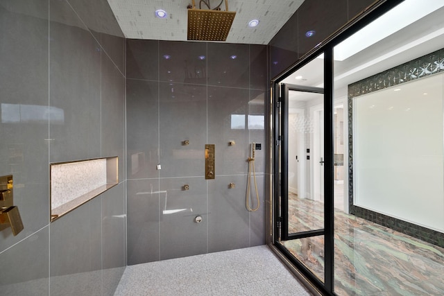 bathroom with tiled shower