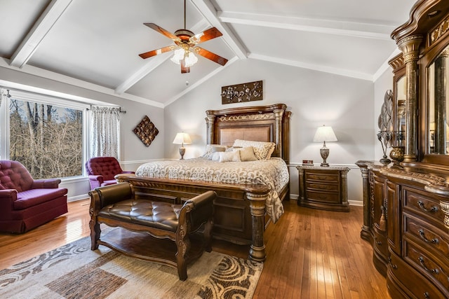 bedroom featuring ceiling fan, lofted ceiling with beams, and light hardwood / wood-style flooring