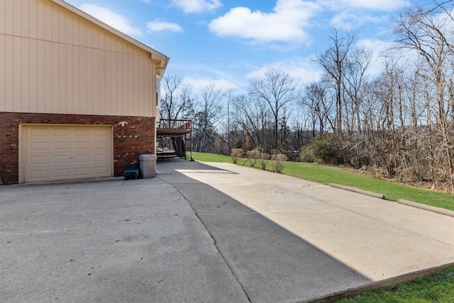 view of patio / terrace featuring a garage and a deck