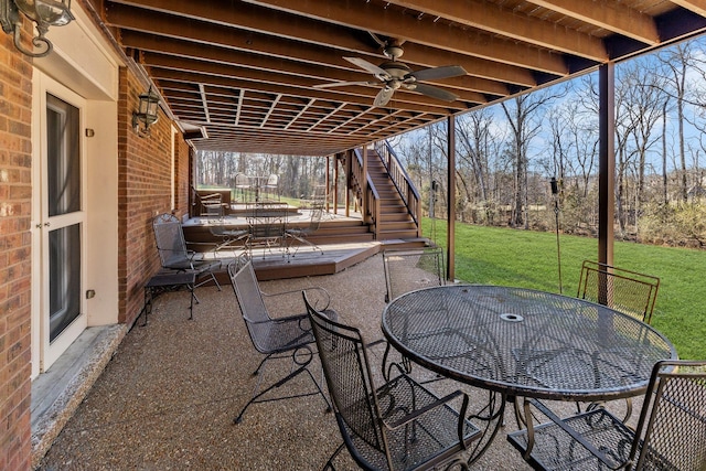 view of patio featuring ceiling fan