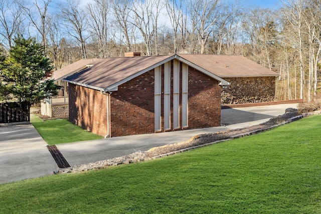 view of outbuilding with a yard