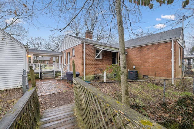 back of property featuring a patio and central air condition unit