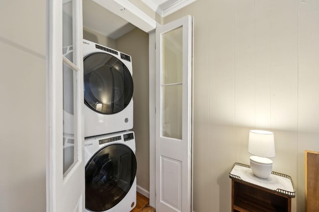 laundry room with stacked washer and clothes dryer