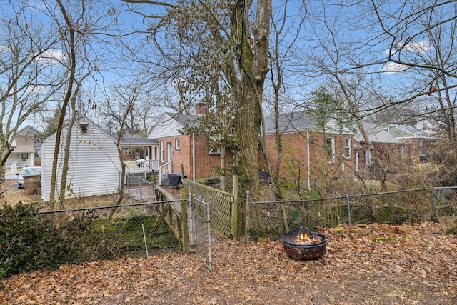 view of yard with an outdoor fire pit