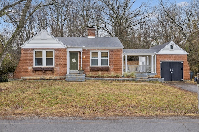 view of front of home with a garage and a front yard