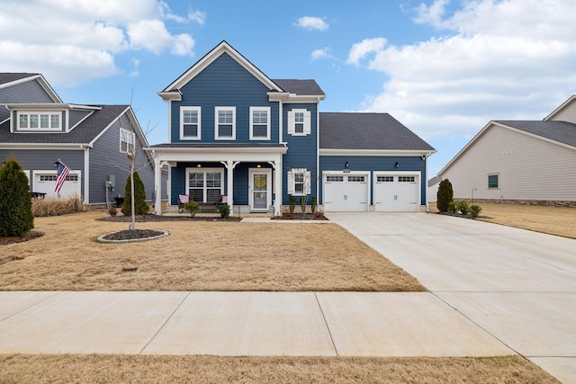 view of front of property with a garage and covered porch