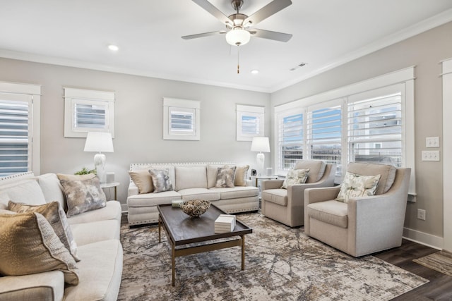 living room featuring crown molding, dark wood-type flooring, and ceiling fan