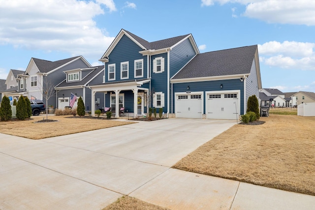 view of front of home with a garage, a porch, and a front lawn