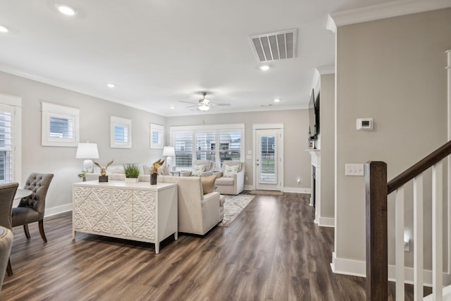 living room featuring ornamental molding and dark hardwood / wood-style floors