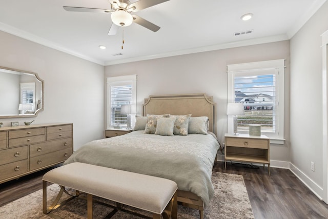 bedroom with multiple windows, ornamental molding, and dark hardwood / wood-style flooring