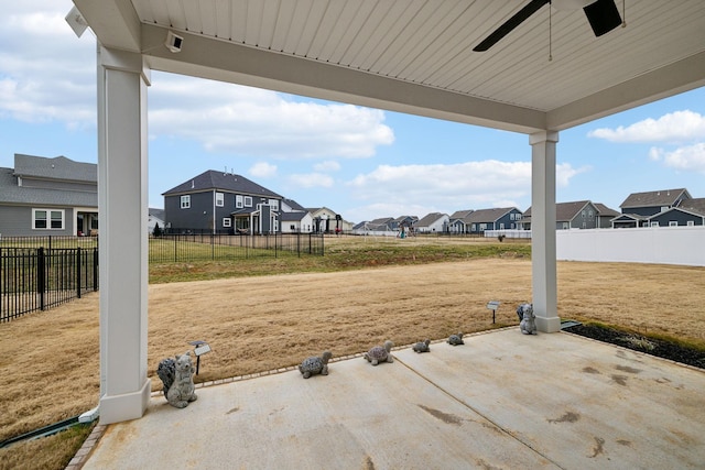 view of yard with a patio and ceiling fan