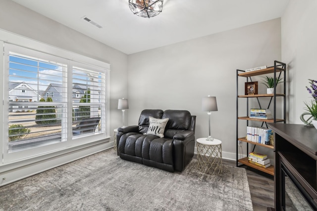 sitting room with wood-type flooring