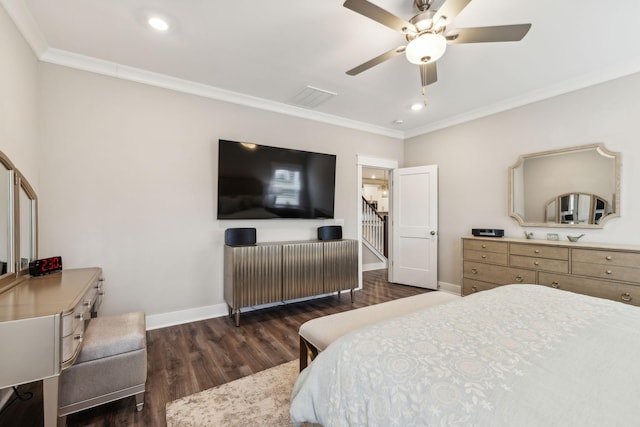 bedroom with ornamental molding, ceiling fan, and dark hardwood / wood-style flooring