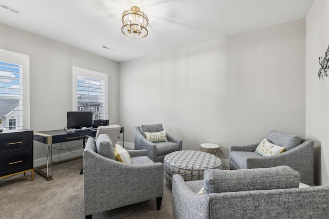 interior space featuring light colored carpet and a notable chandelier