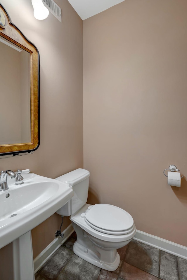 bathroom featuring sink and toilet